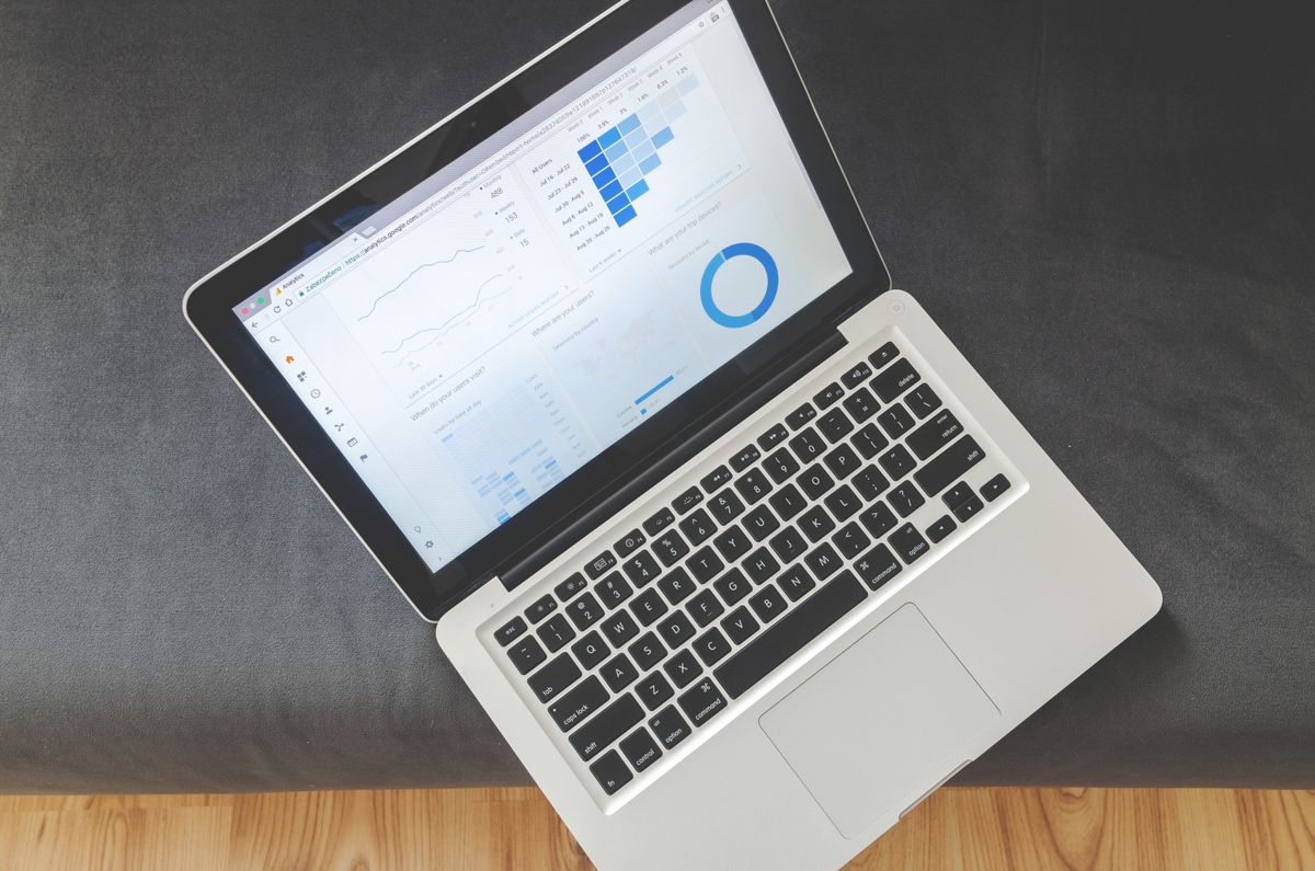 Analytics dashboard on a laptop screen showing website traffic and search performance data