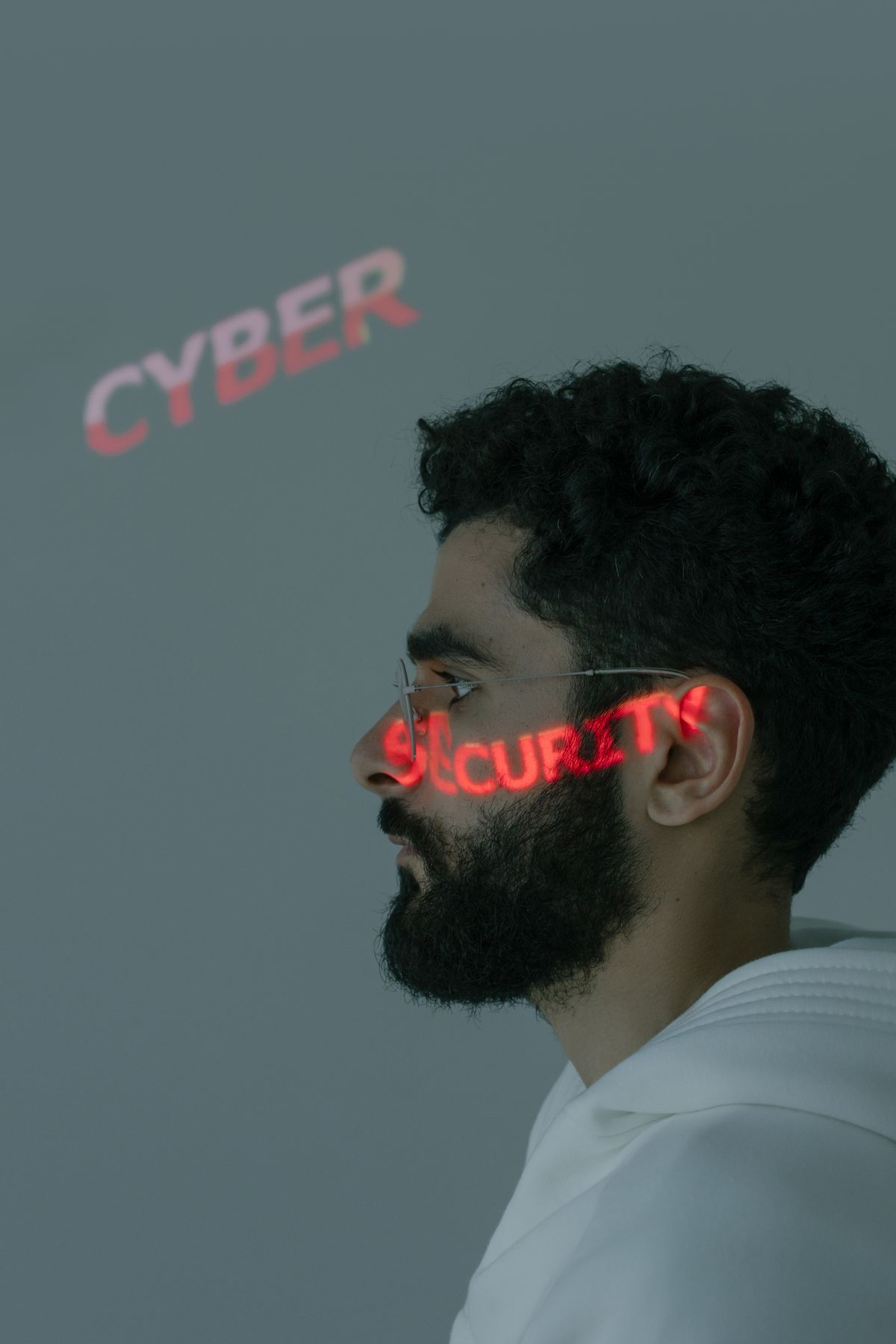 Cybersecurity trainee working through certification exam preparation material on a laptop