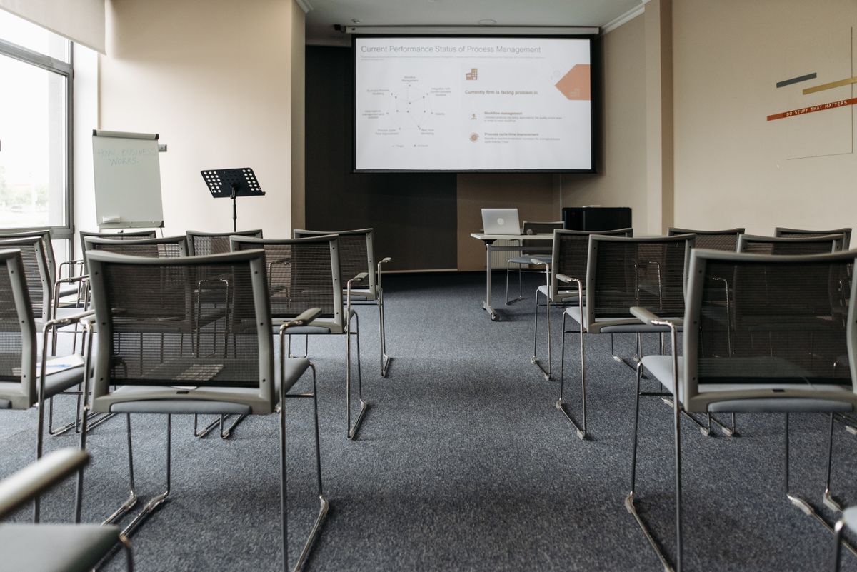 Corporate employees participating in a digital skills training workshop in a conference room